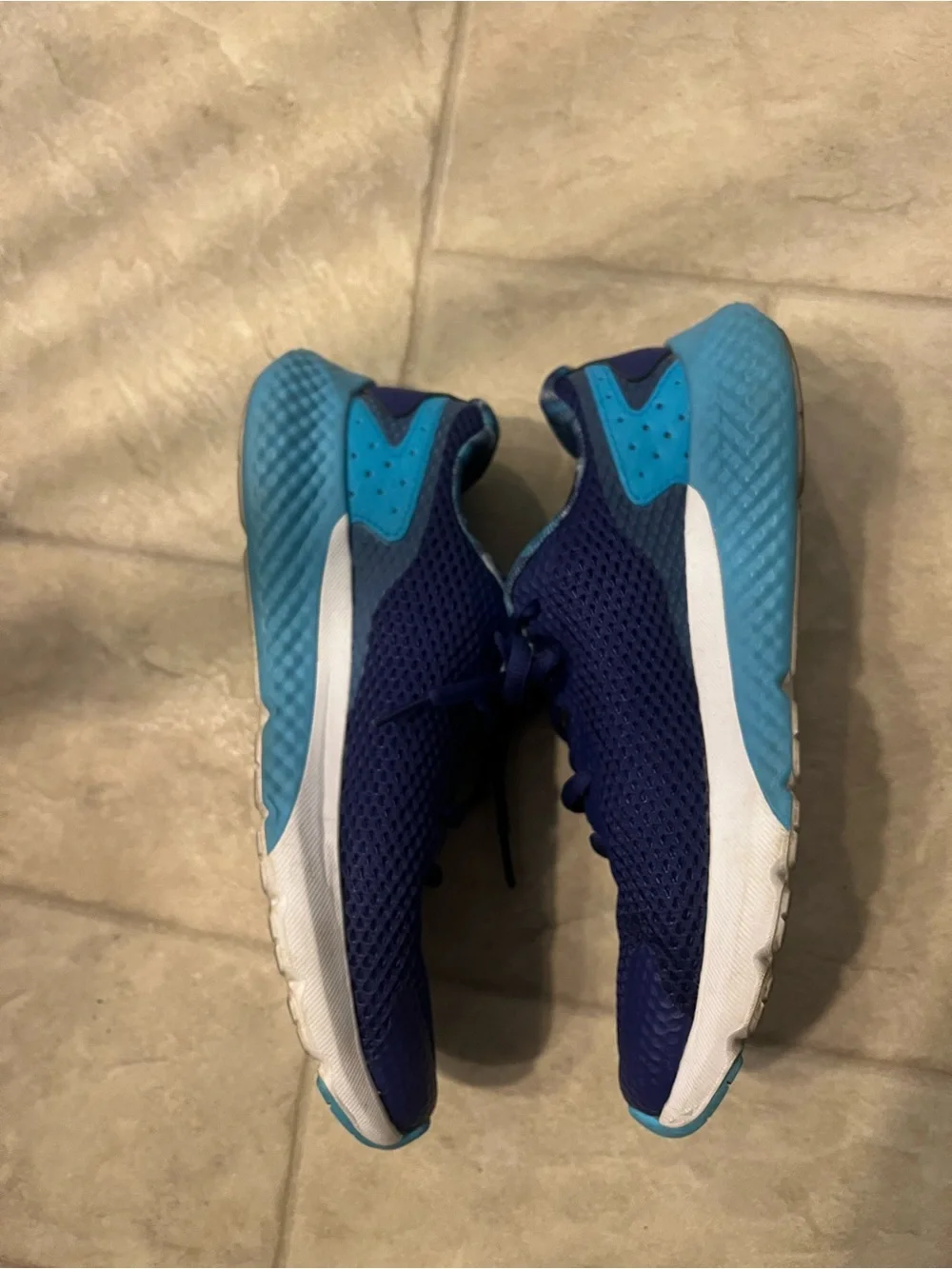 Under Armour Charged Rogue running shoes. Purple and teal. 6y or 7.5-8 women.